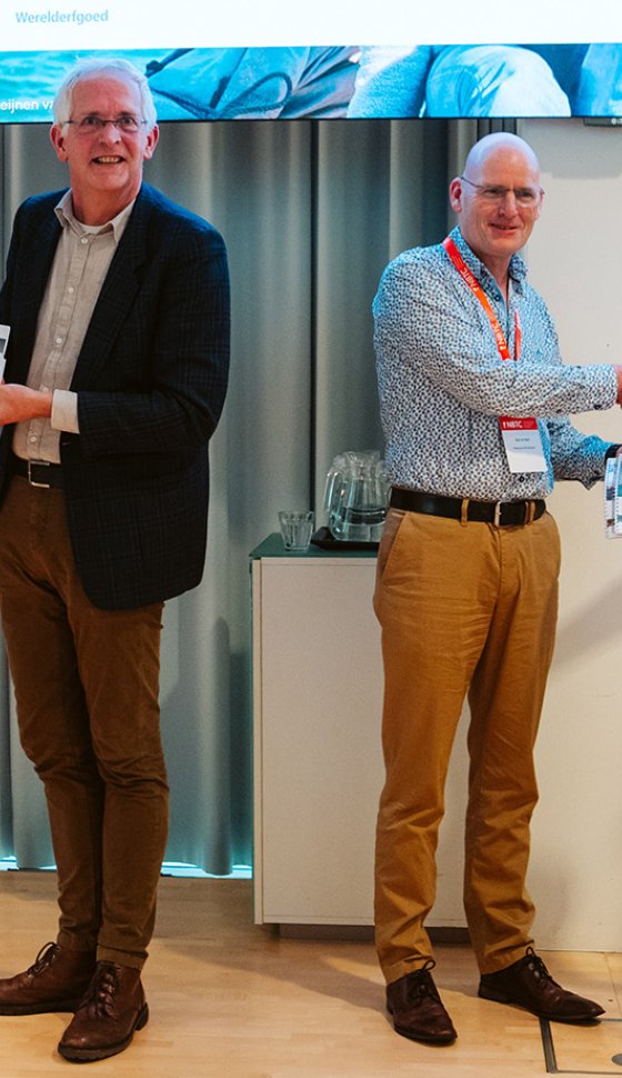 Overhandiging Publieksonderzoek en Marketingadvies UNESCO Werelderfgoed tijdens Kennisbijeenkomst 'Werelderfgoed Samen Zichtbaar'